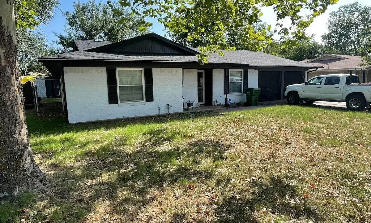 Professional roofing crew working on a residential roof in Wildwood